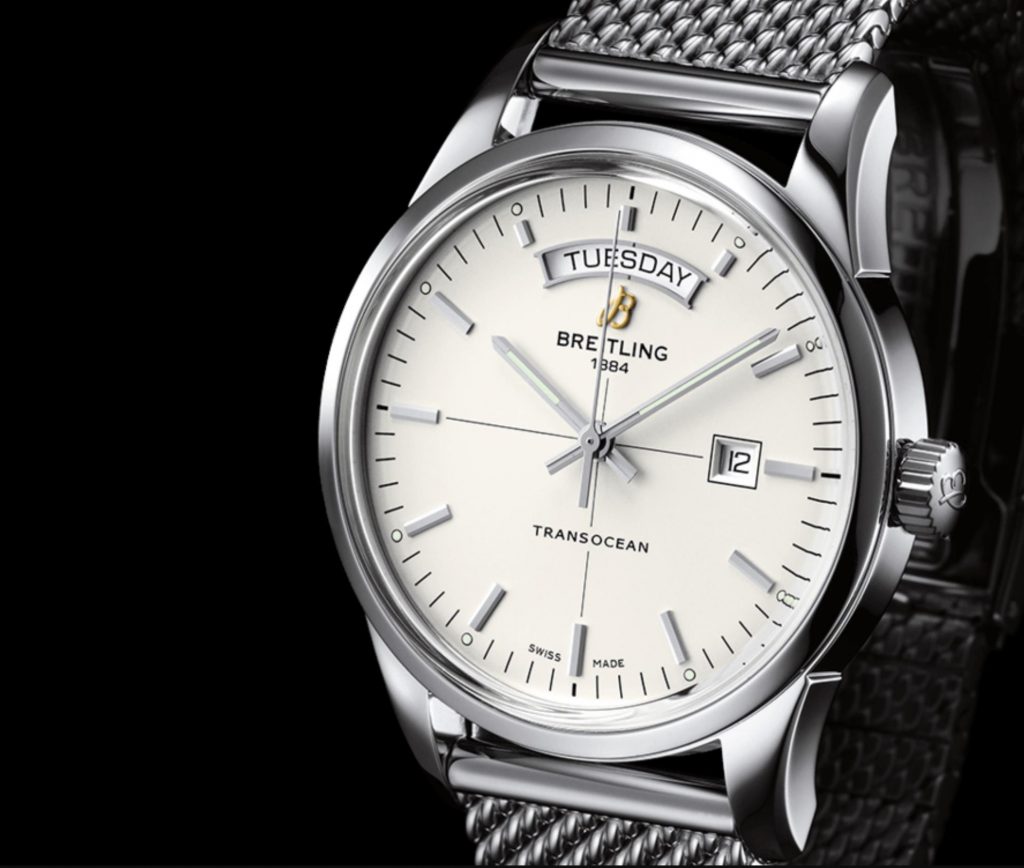 The silvery dial fake watch has both day and date windows.